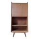 Vintage 1960s secretary desk with an angled design, light wood, and tapered legs.