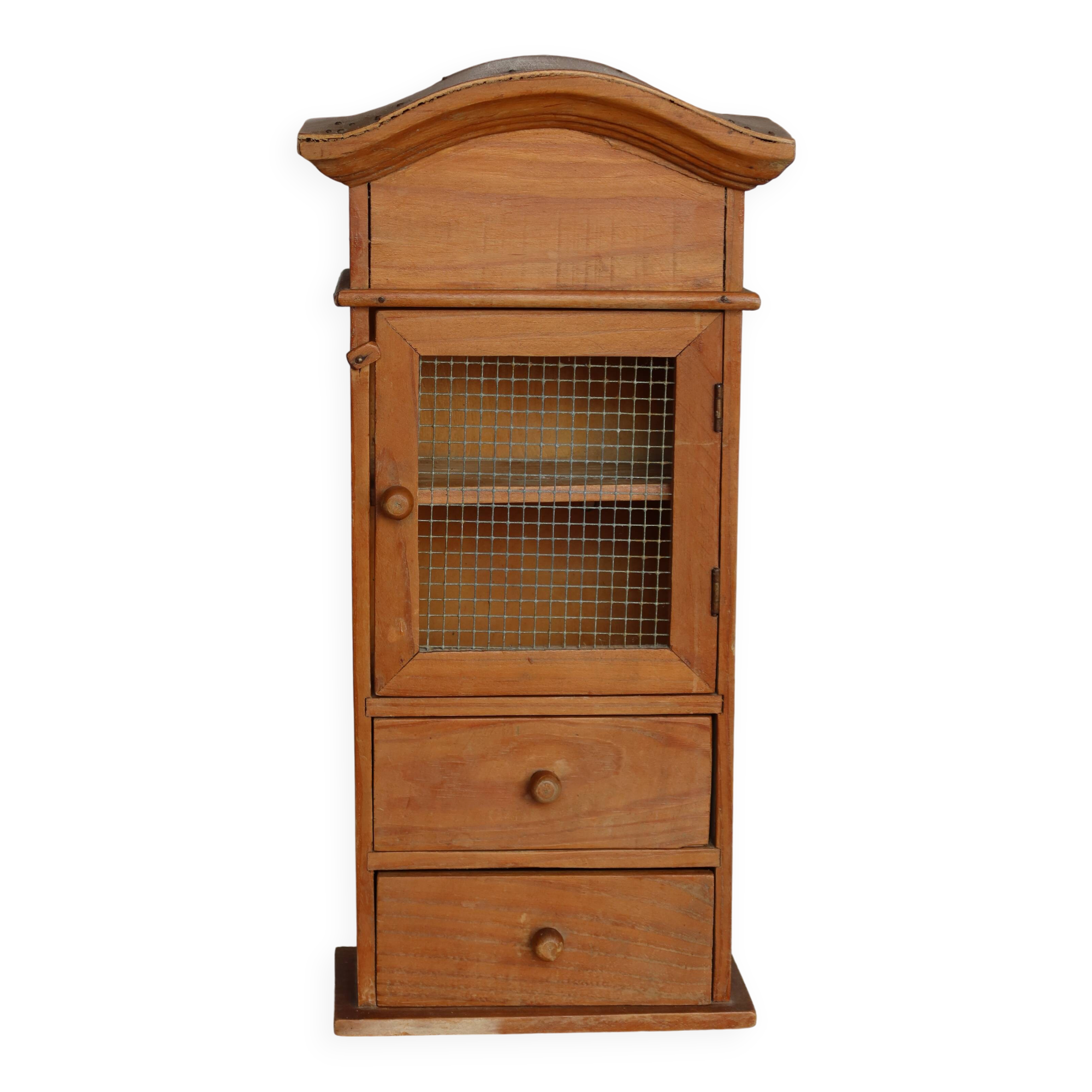 Vintage wooden shelf with drawers and mesh door.