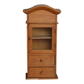 Vintage wooden shelf with drawers and mesh door.