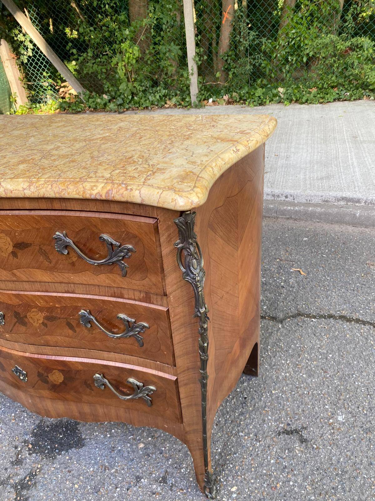 Curved Louis XV chest of drawers in marquetry and beige marble