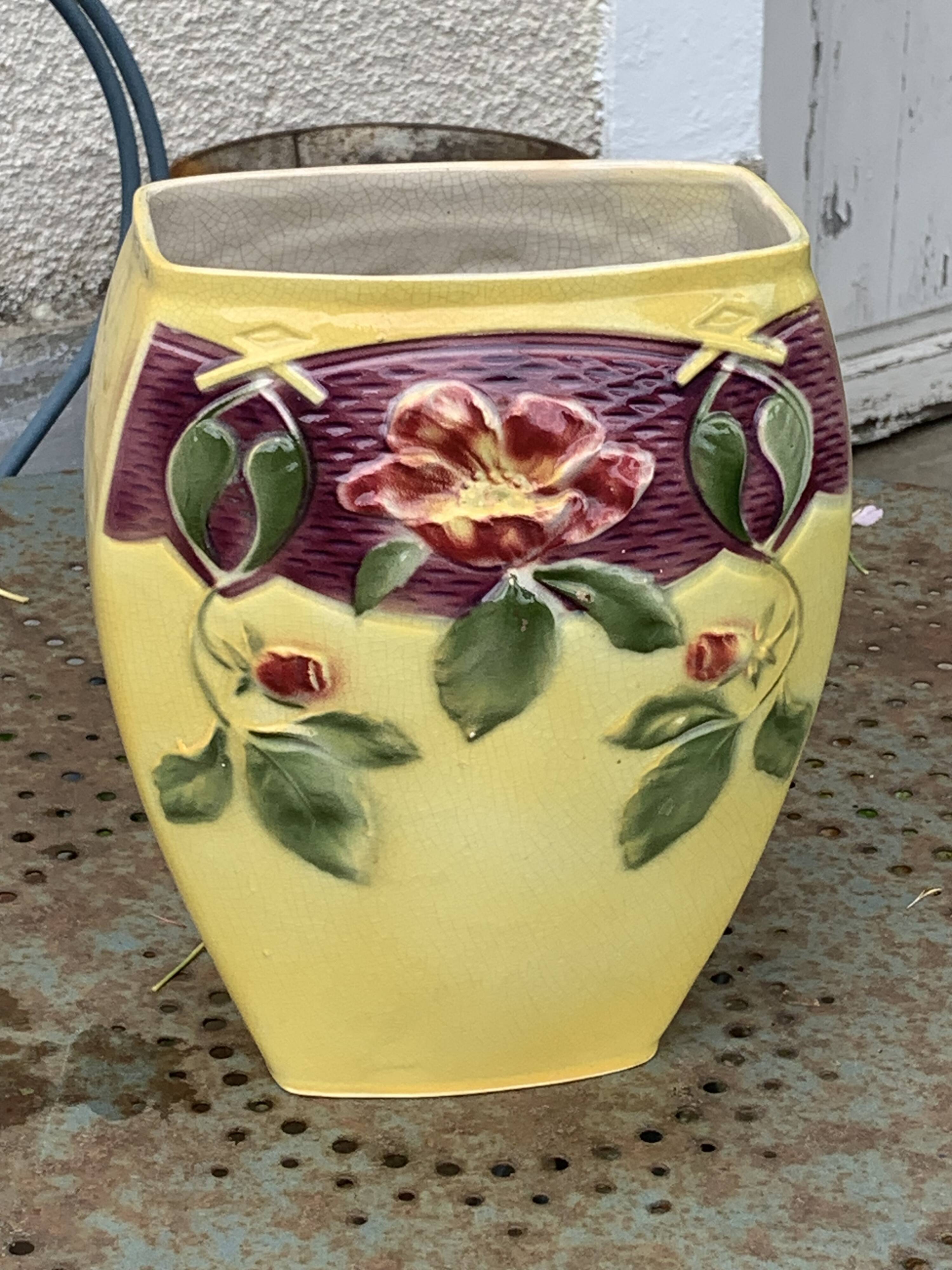 Yellow glazed ceramic slip vase with hawthorn pink flower motif