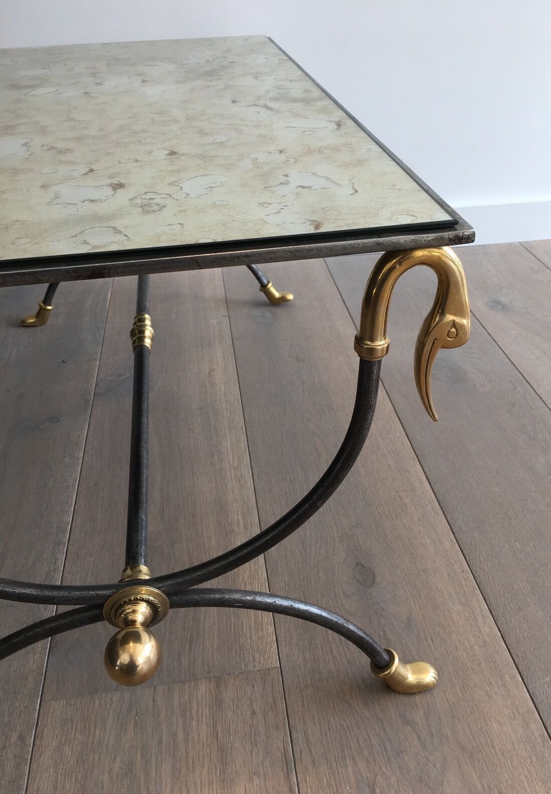 Coffee table in brushed steel and brass