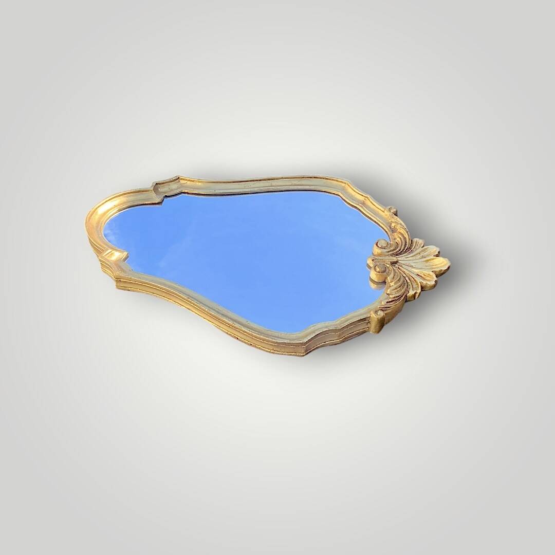 Vintage wall mirror with golden resin shell