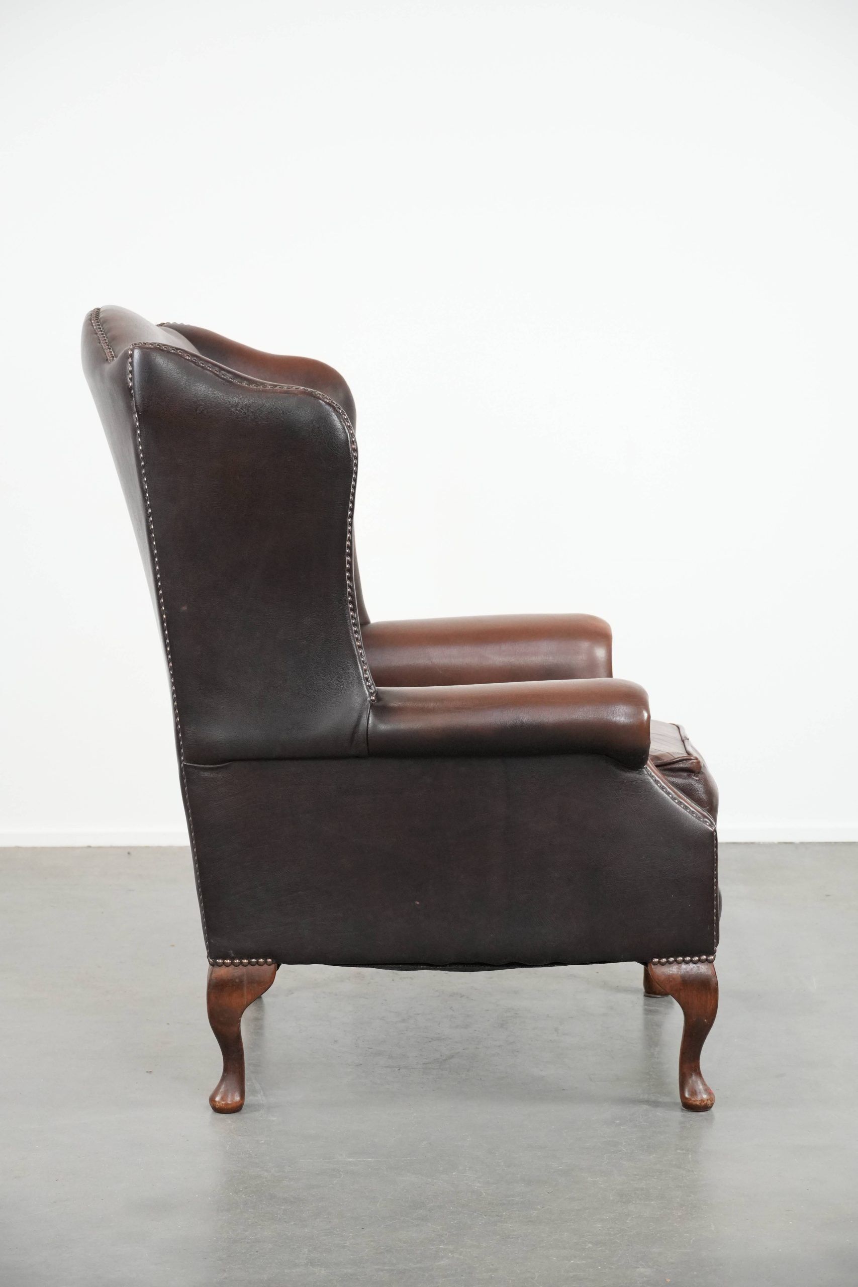 Brown smooth cow leather Chesterfield wingback armchair in English style