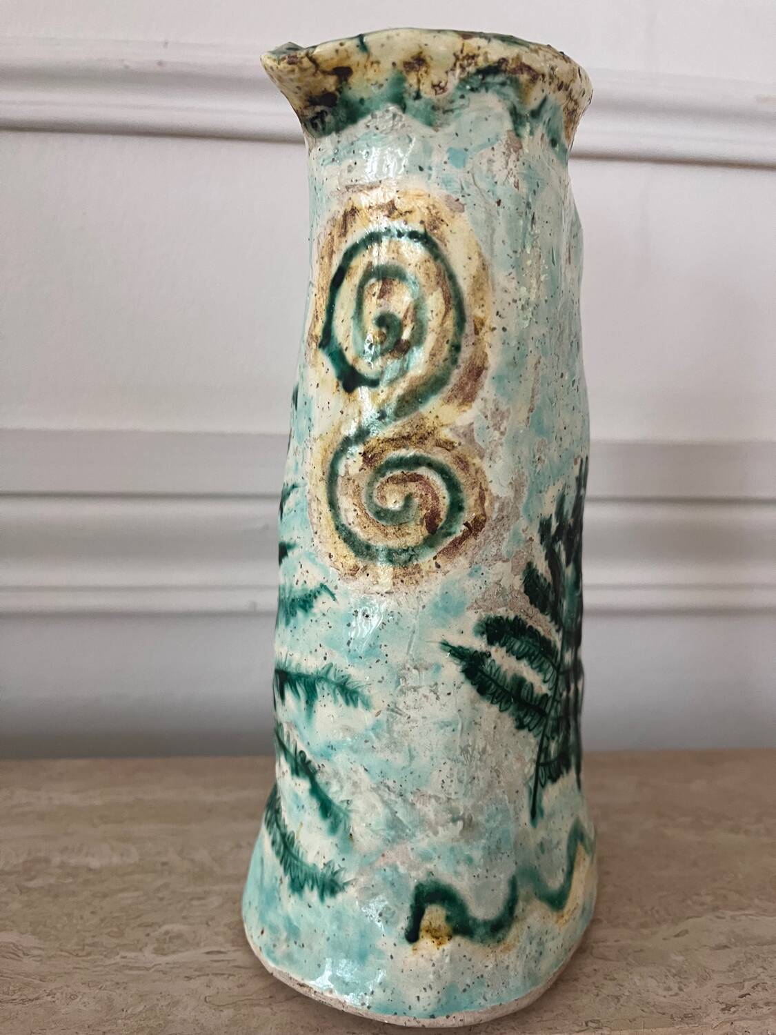 Antique handcrafted ceramic pitcher
