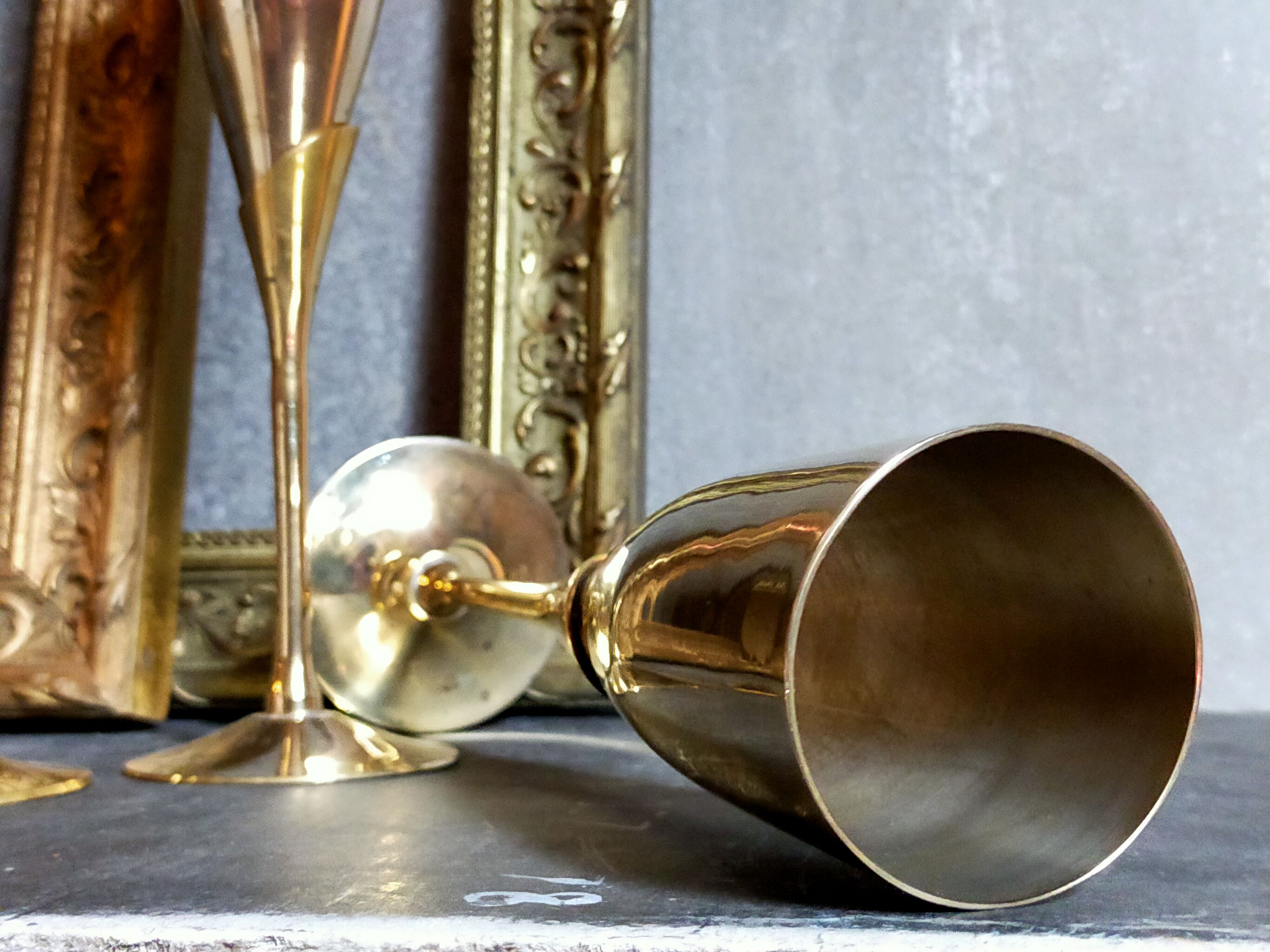 Six brass champagne coupes