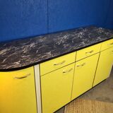 Vintage yellow sideboard, and black marble top.