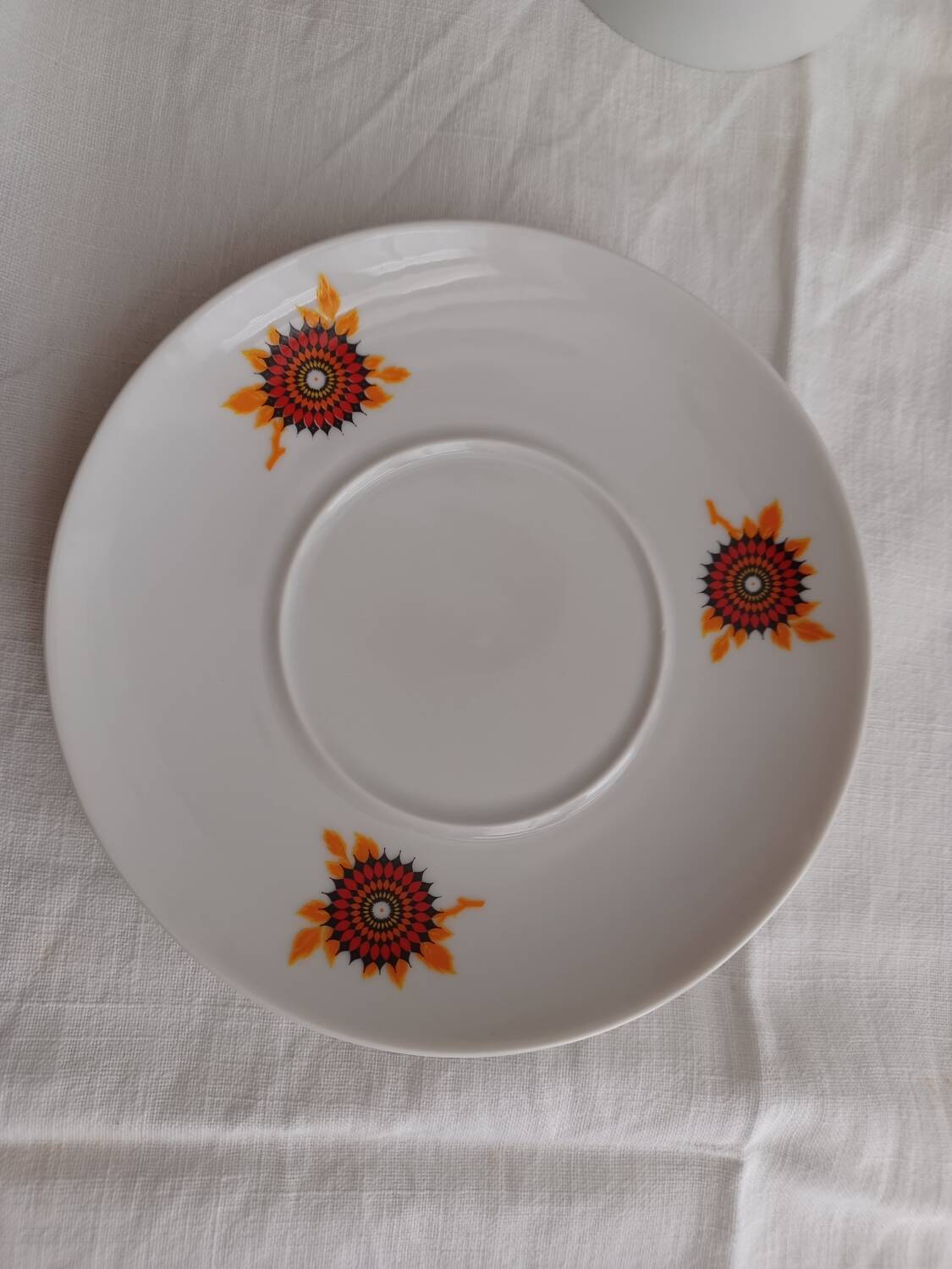 Vintage orange patterned cup and saucer