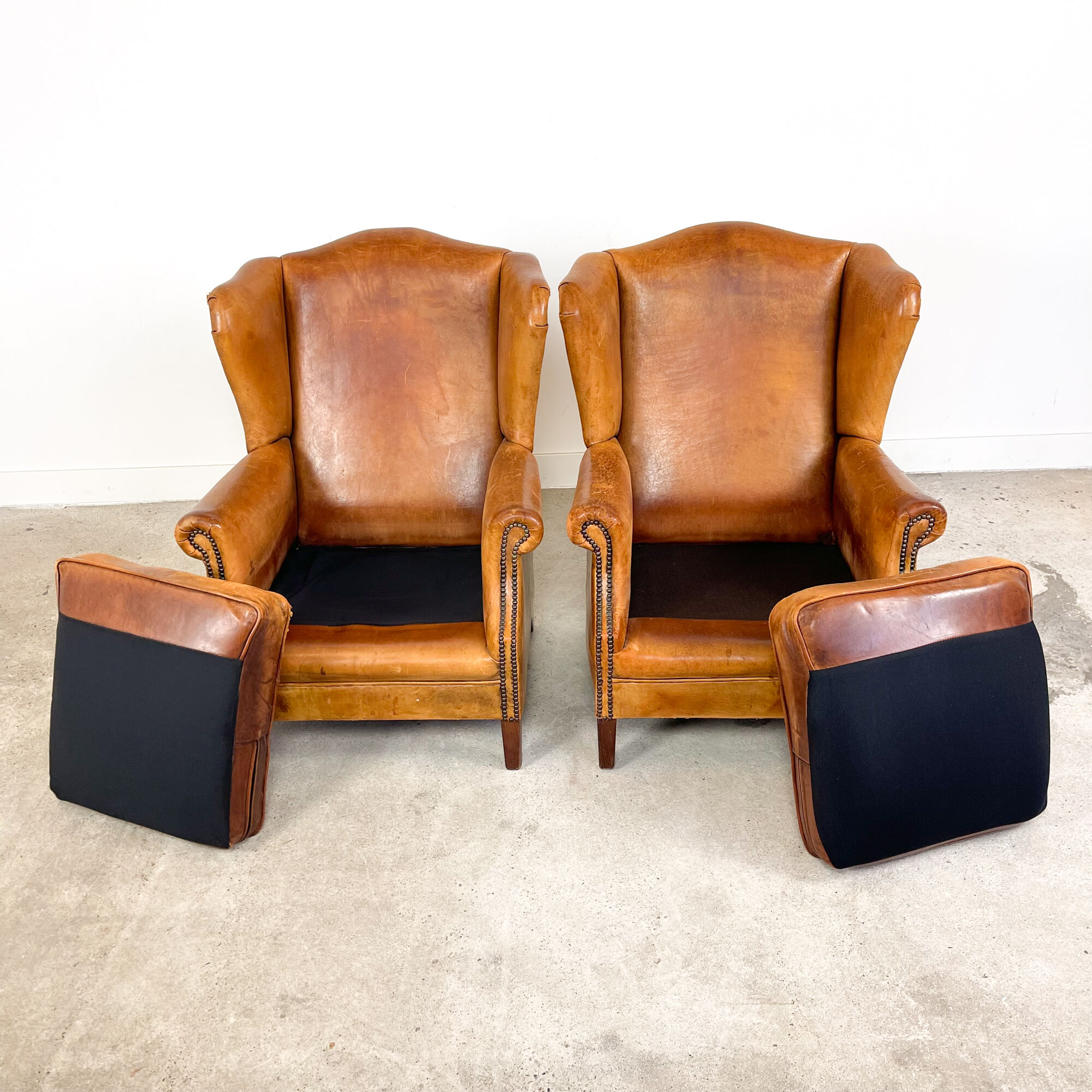 Set of two sheep leather wingback armchairs Delft