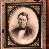 Black and gilded ebonite frame, wood and plaster 19th century