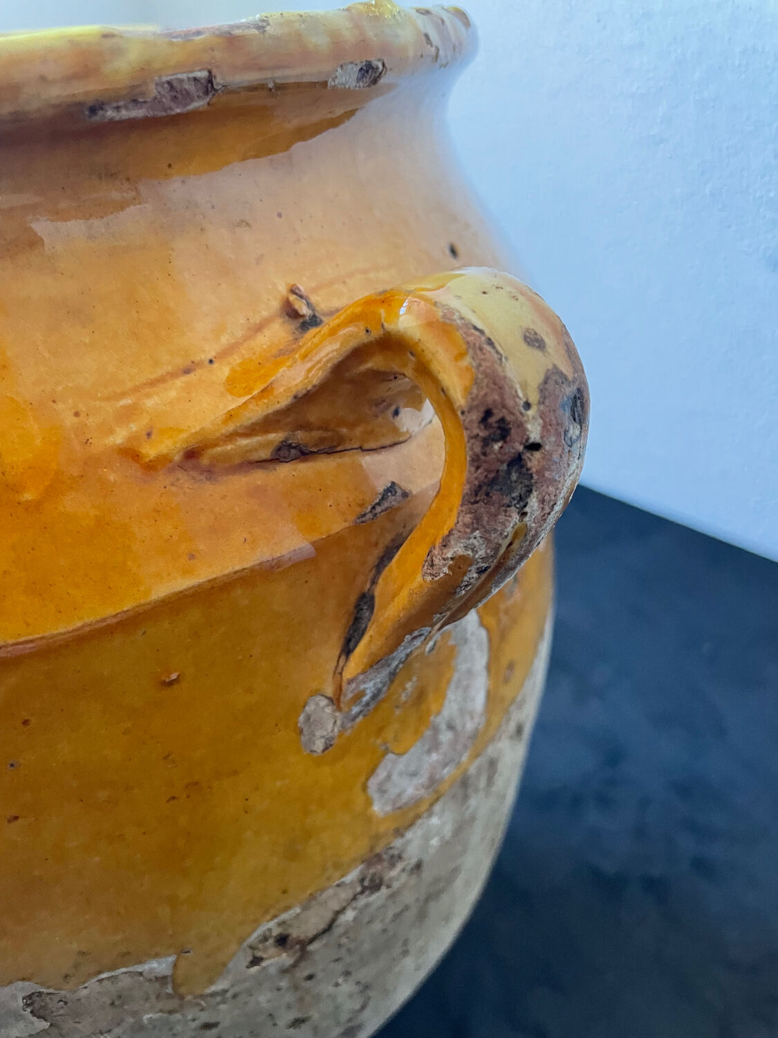 Old yellow glazed terracotta grease pot south west France