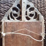 Old mirror in carved and gilded wood