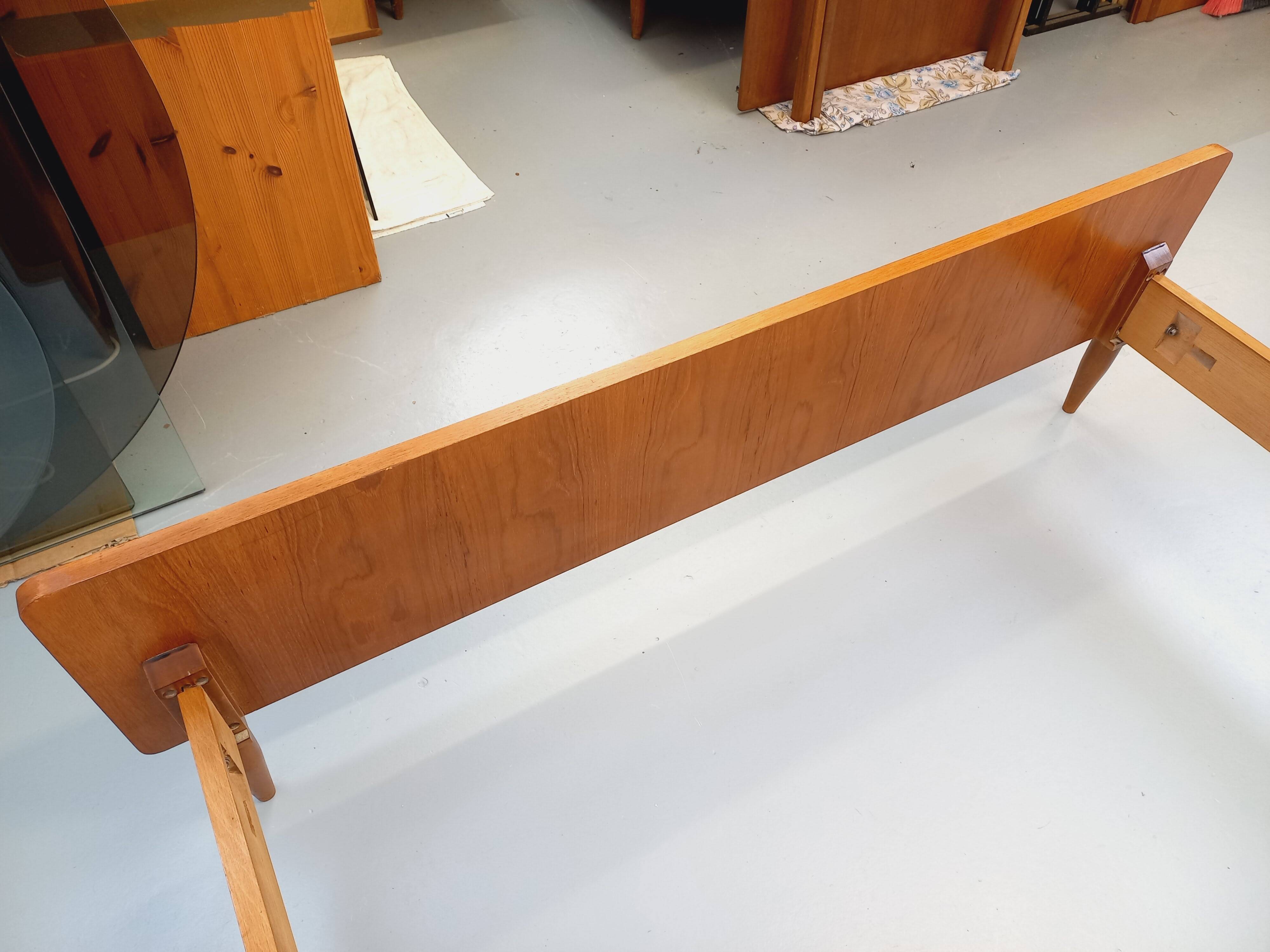 Double bed in vintage Scandinavian style from the 1960s with bedside tables.