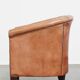English club chair in light cognac cowhide leather.