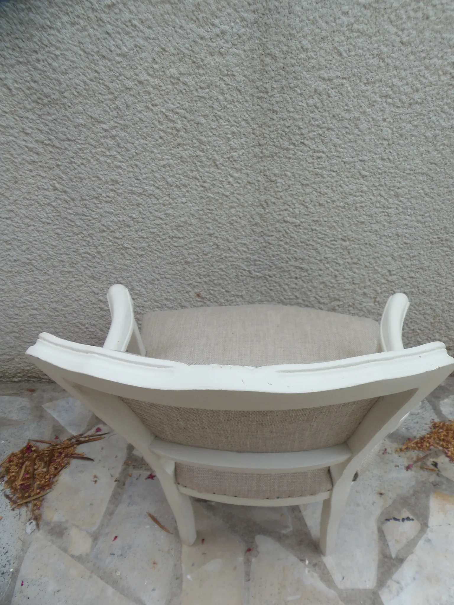 Louis XV style armchair, delicately patinated in a soft beige hue.