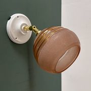 Vintage globe wall light in frosted pink and gold glass.