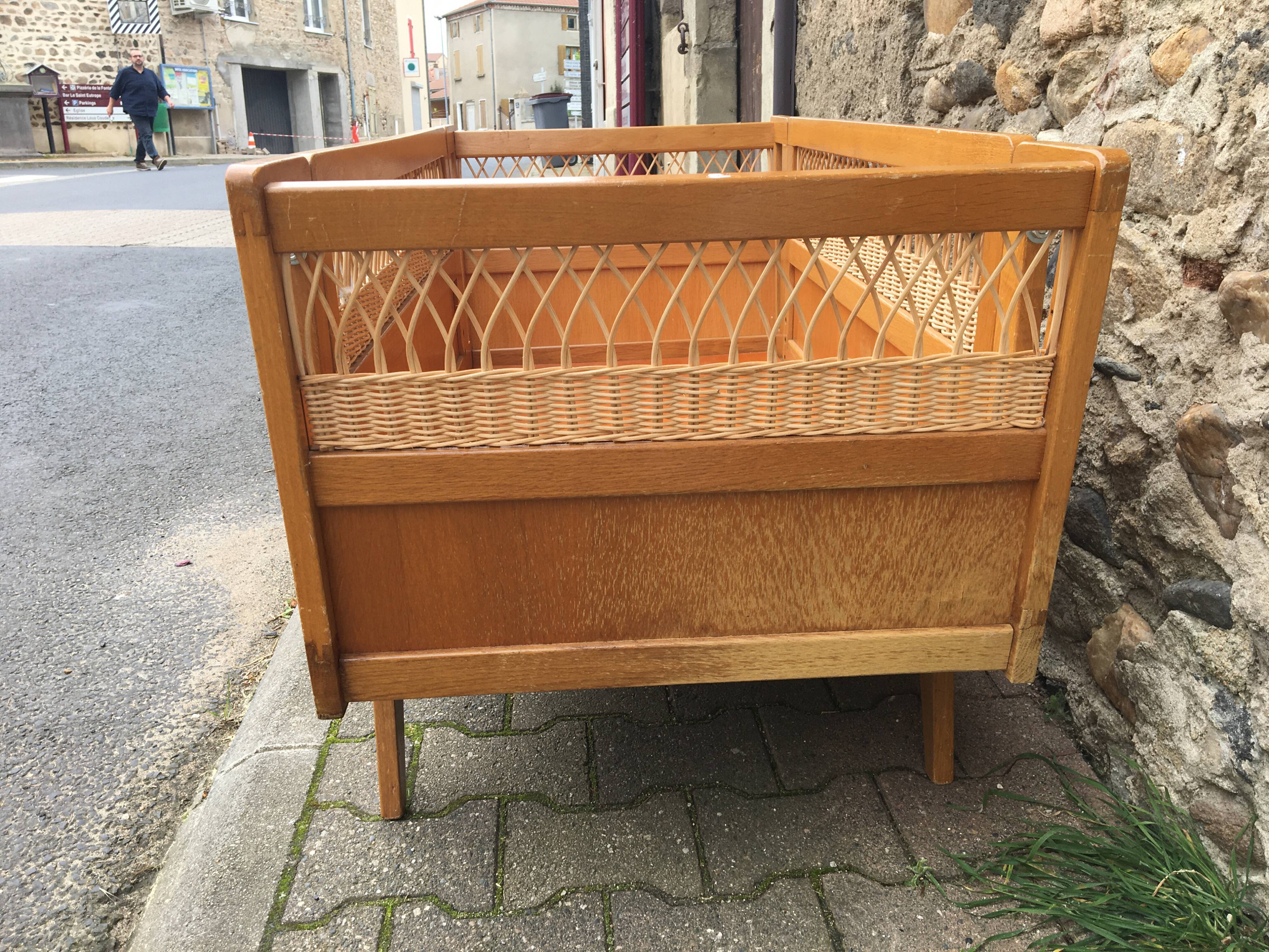 Wooden and rattan baby bed