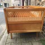 Wooden and rattan baby bed
