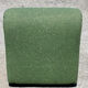 Green armchairs designed by Étienne Fermigier