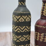 Set of 2 decorative vintage bottles covered with leather & wicker