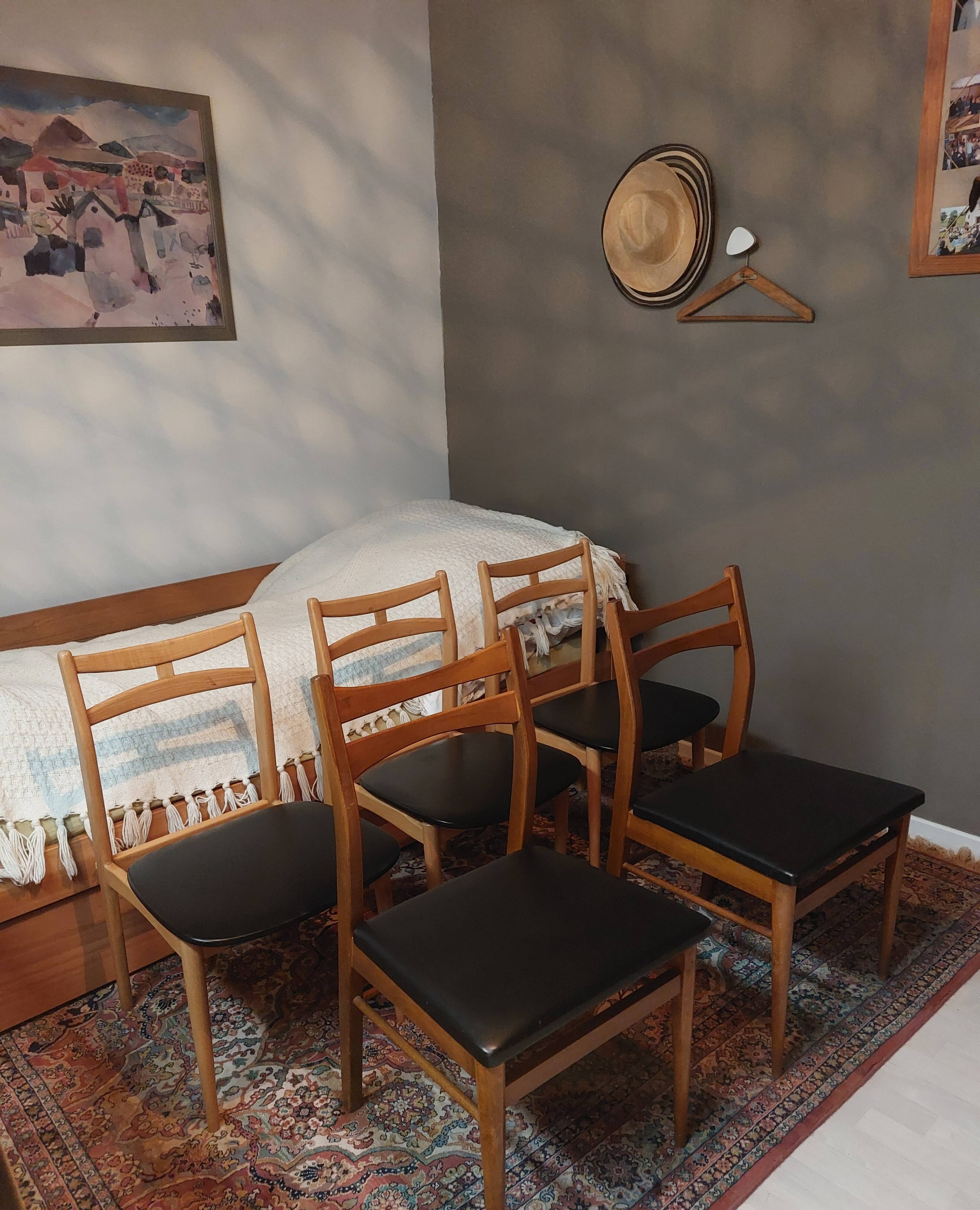 5 Scandinavian style chairs, wood and black faux leather.