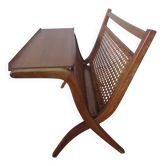 Cane magazine rack with light wood shelf