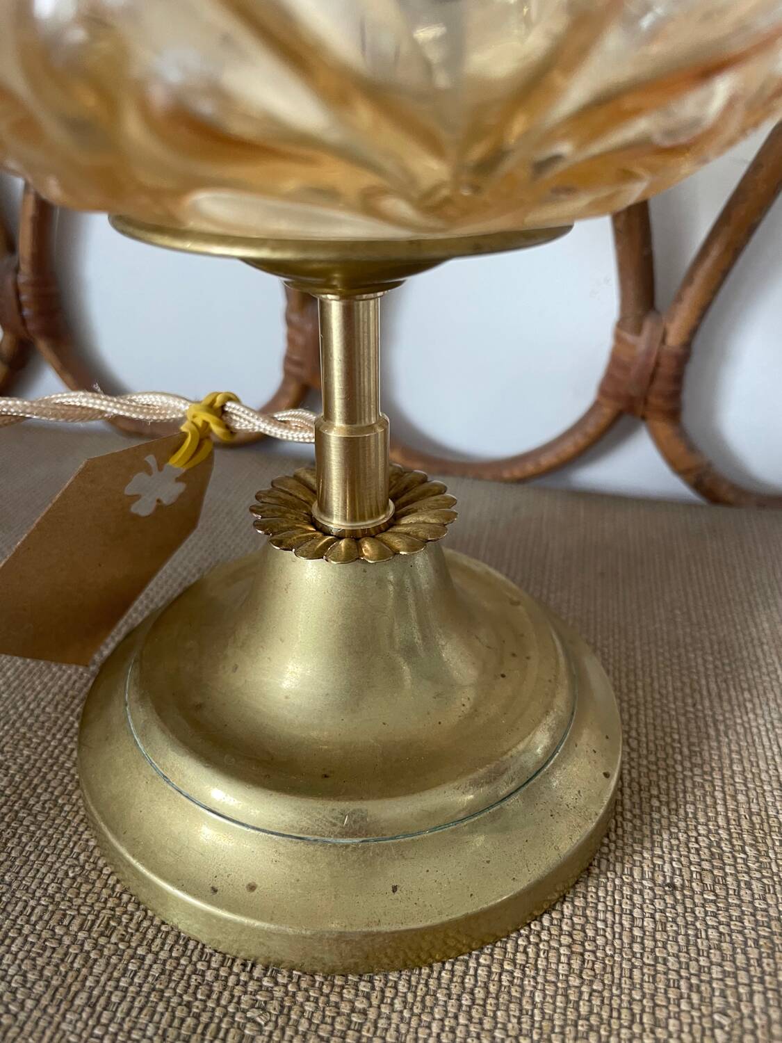 Table lamp with amber glass globe and brass base