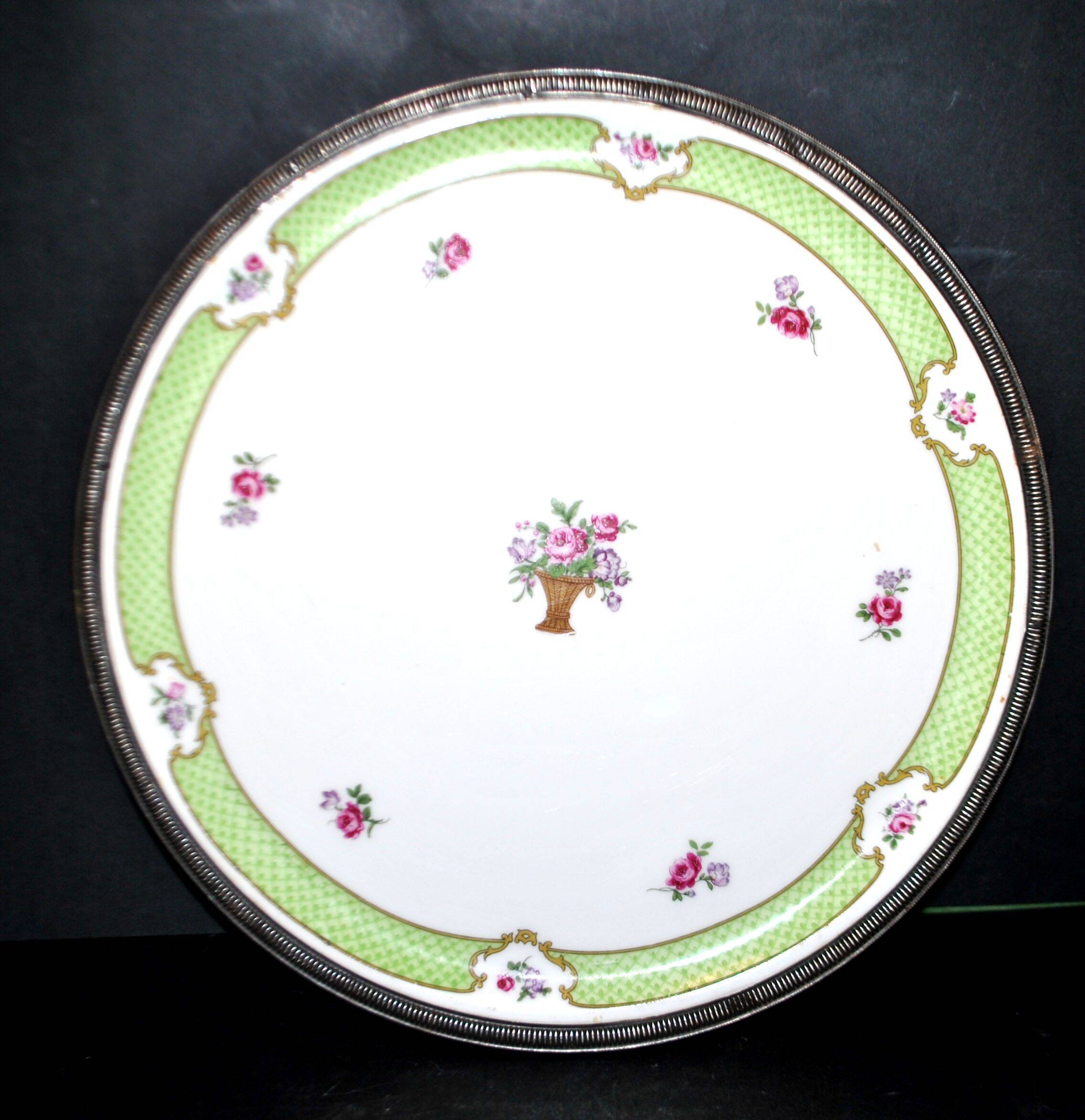 Haviland pie dish in Limoges porcelain with a Minerva silver rim.