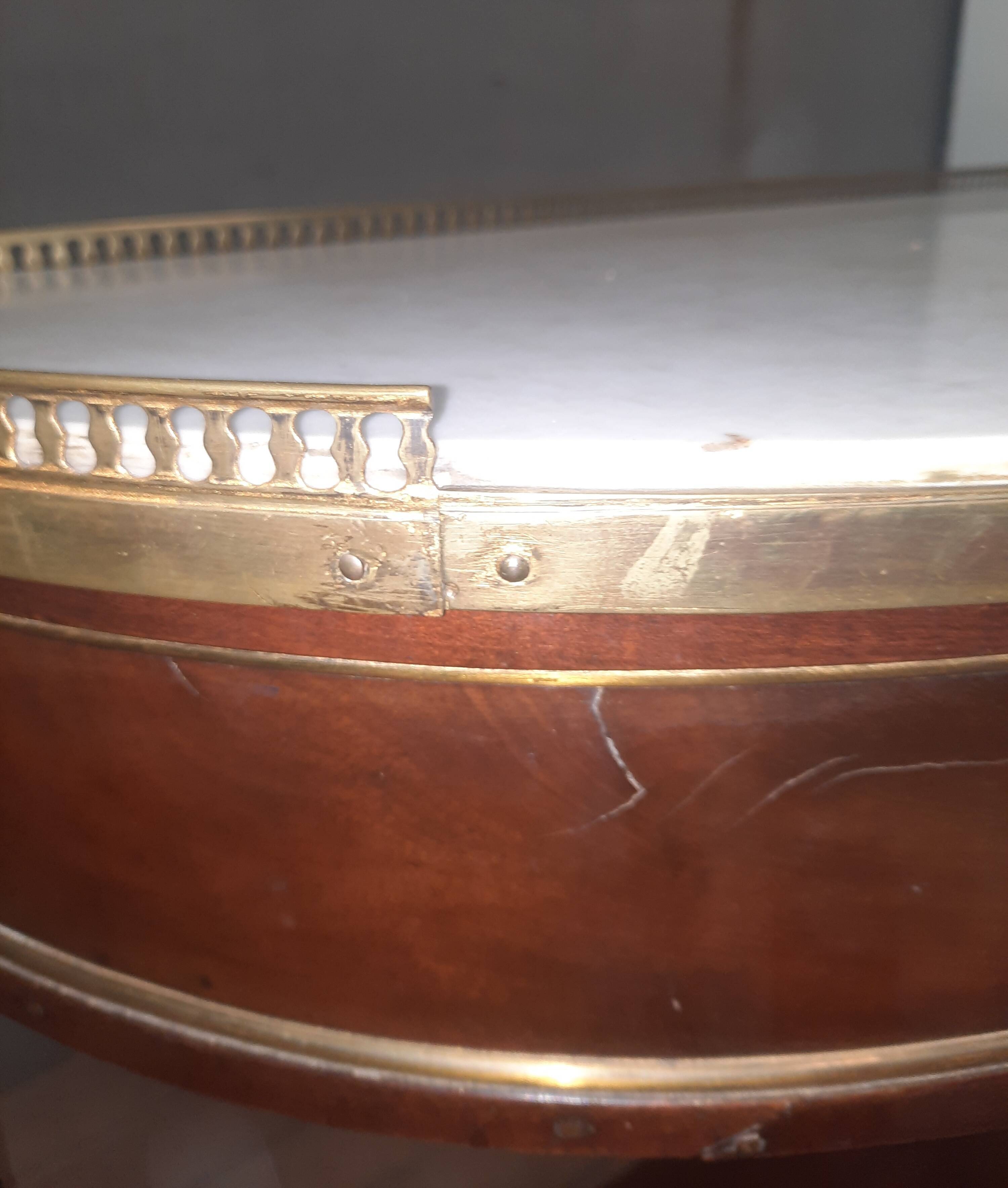 Louis XVI period demi-lune console in mahogany.