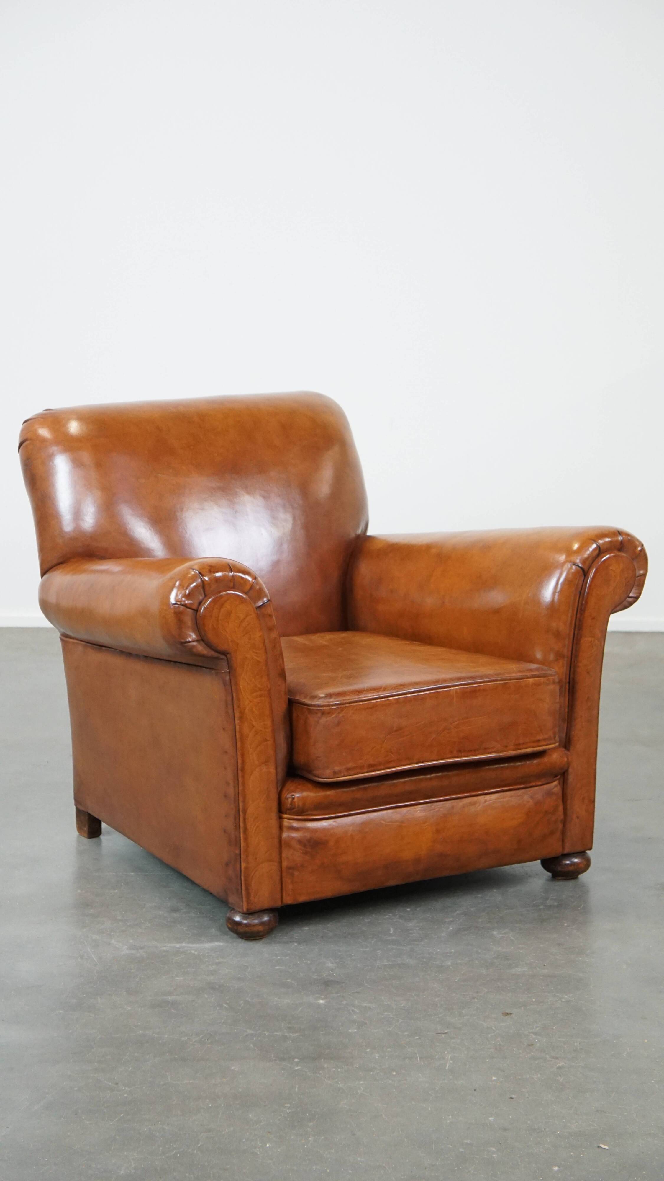 Cognac-colored antique sheep leather armchair