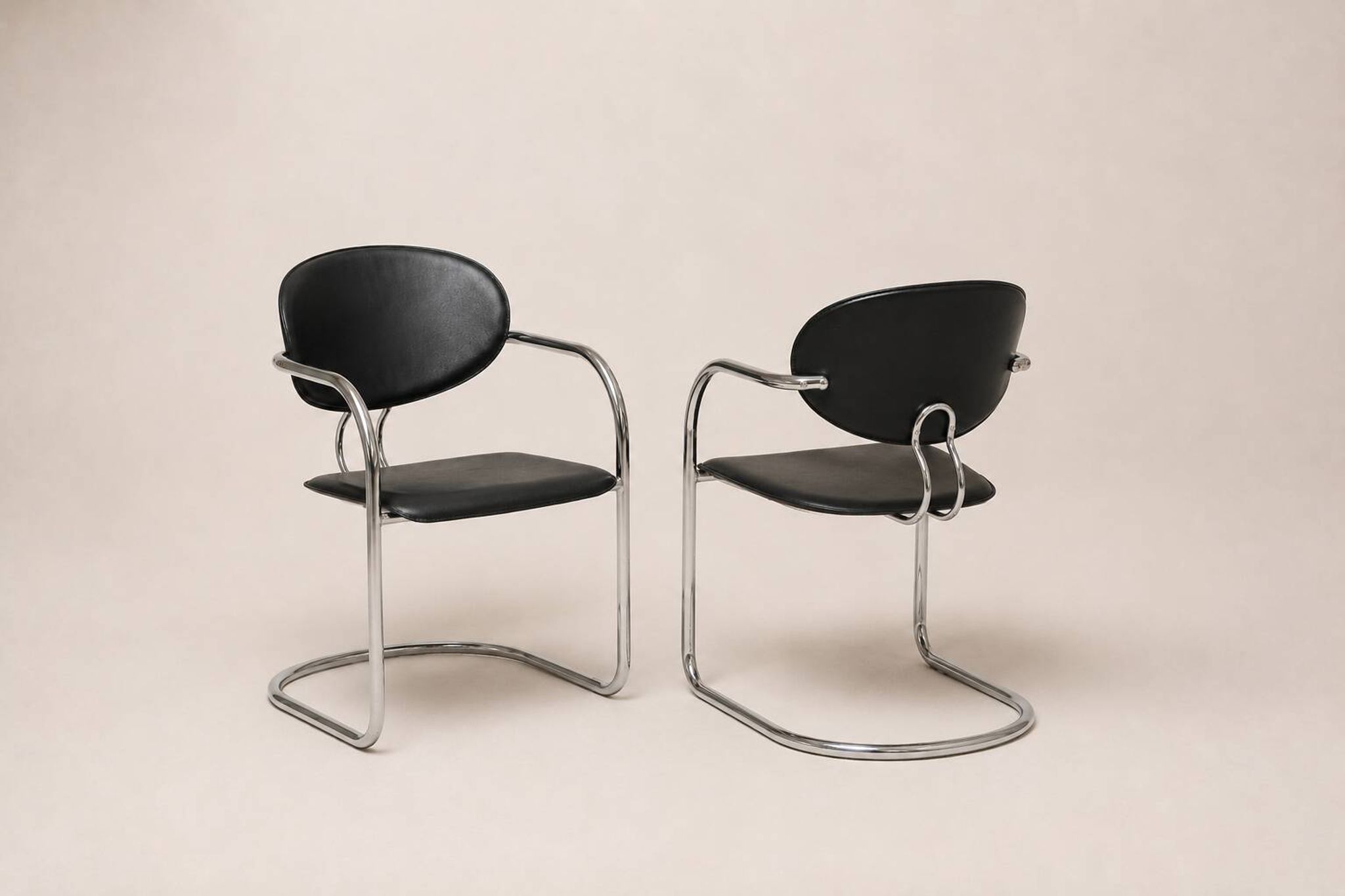 Set of eight cantilever chairs in black faux leather and chrome steel — c. 1980