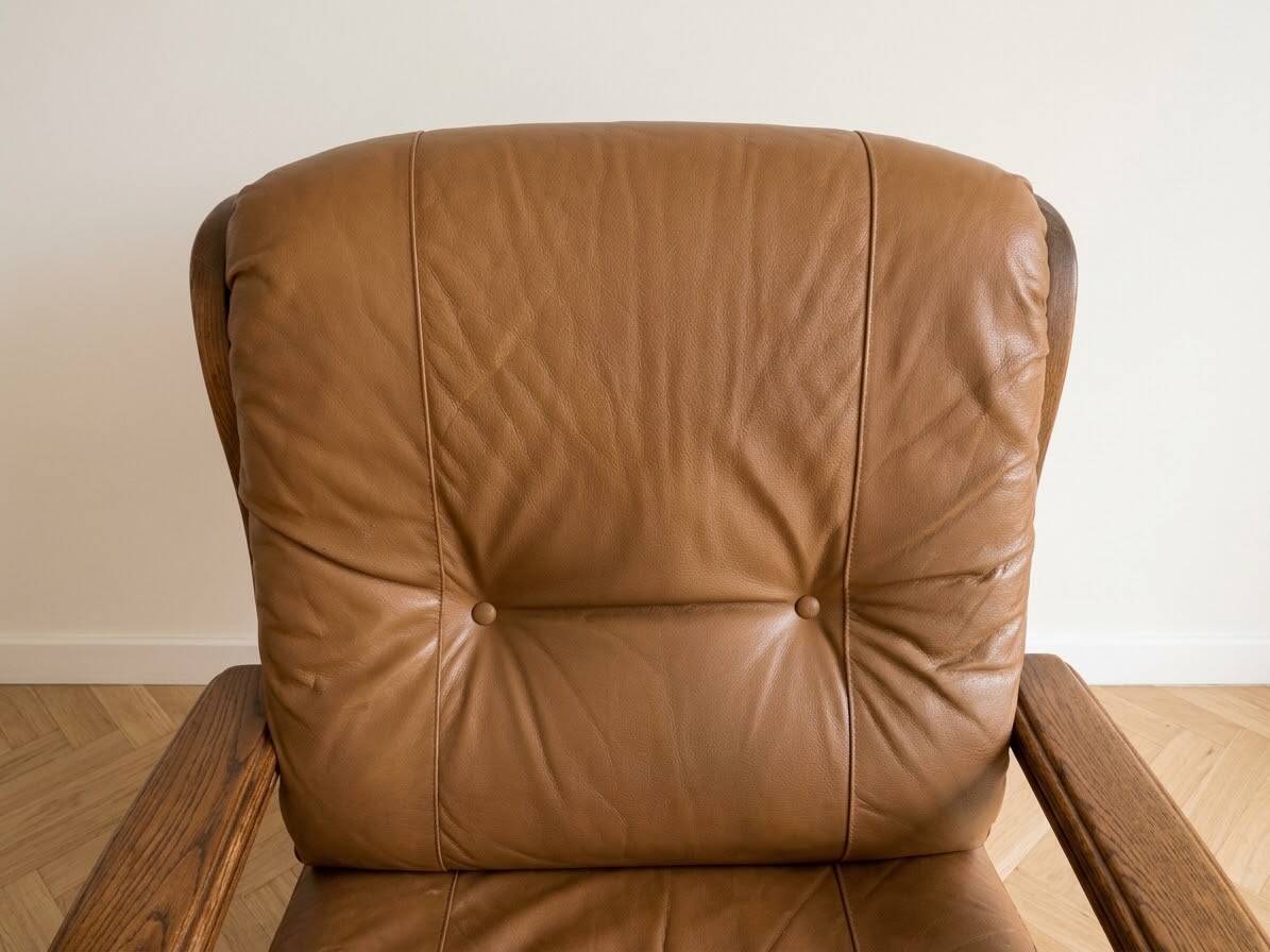 Pair of vintage 1970s armchairs in solid oak and cognac faux leather.