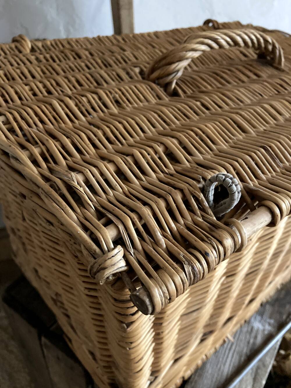 Antique wicker basket with closure and handle