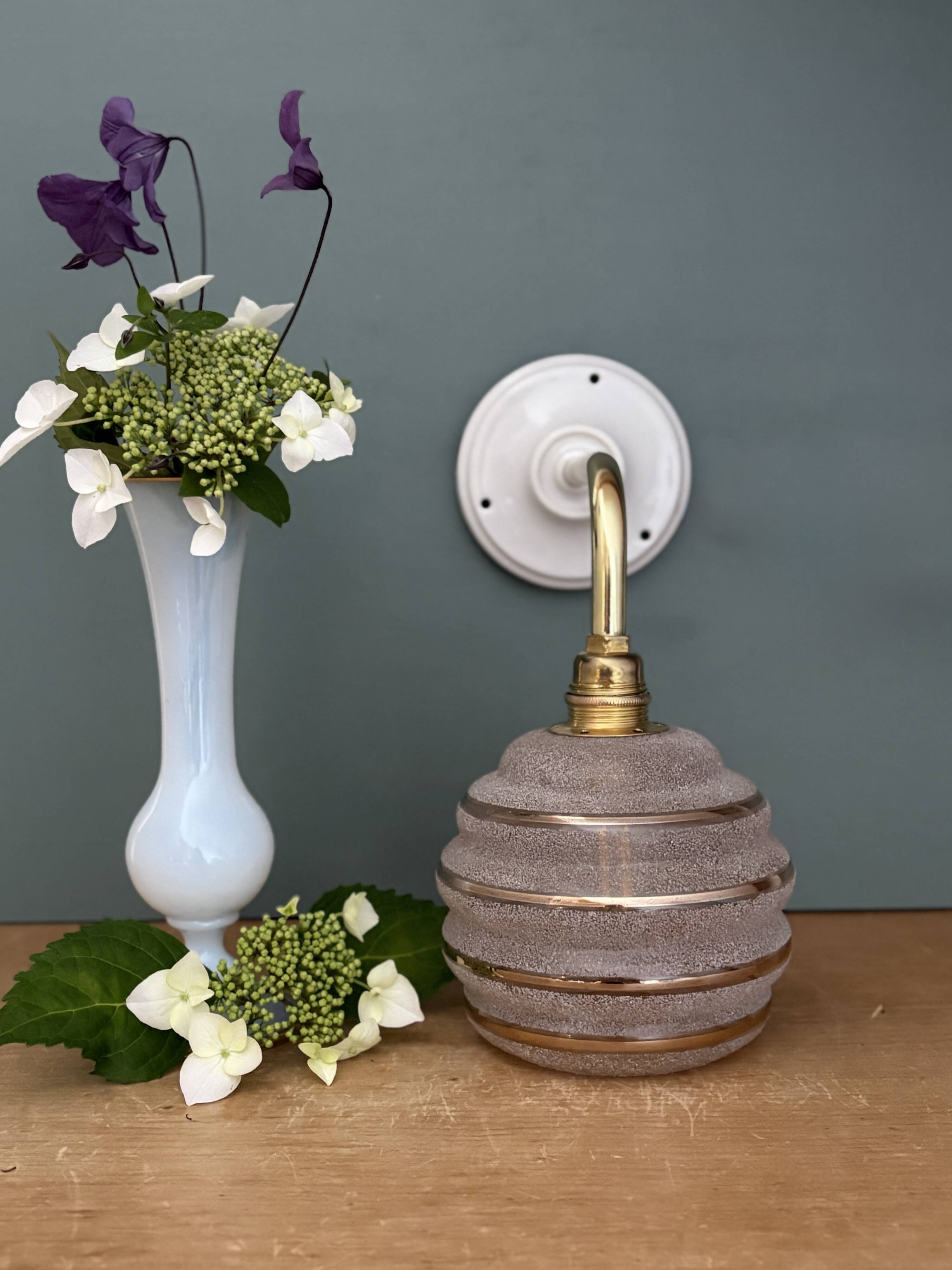 Vintage pink and gold frosted glass globe wall light.