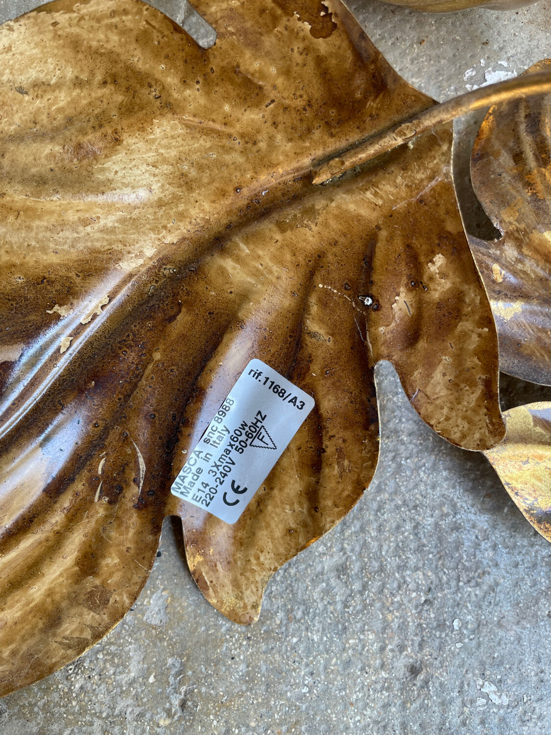 Golden wall lamp foliage