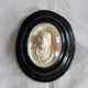 Ancient religious medallion, Jesus Christ in plaster with a blackened wooden frame.