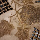 Empty pocket in openwork copper, chiseled and painted vine branches