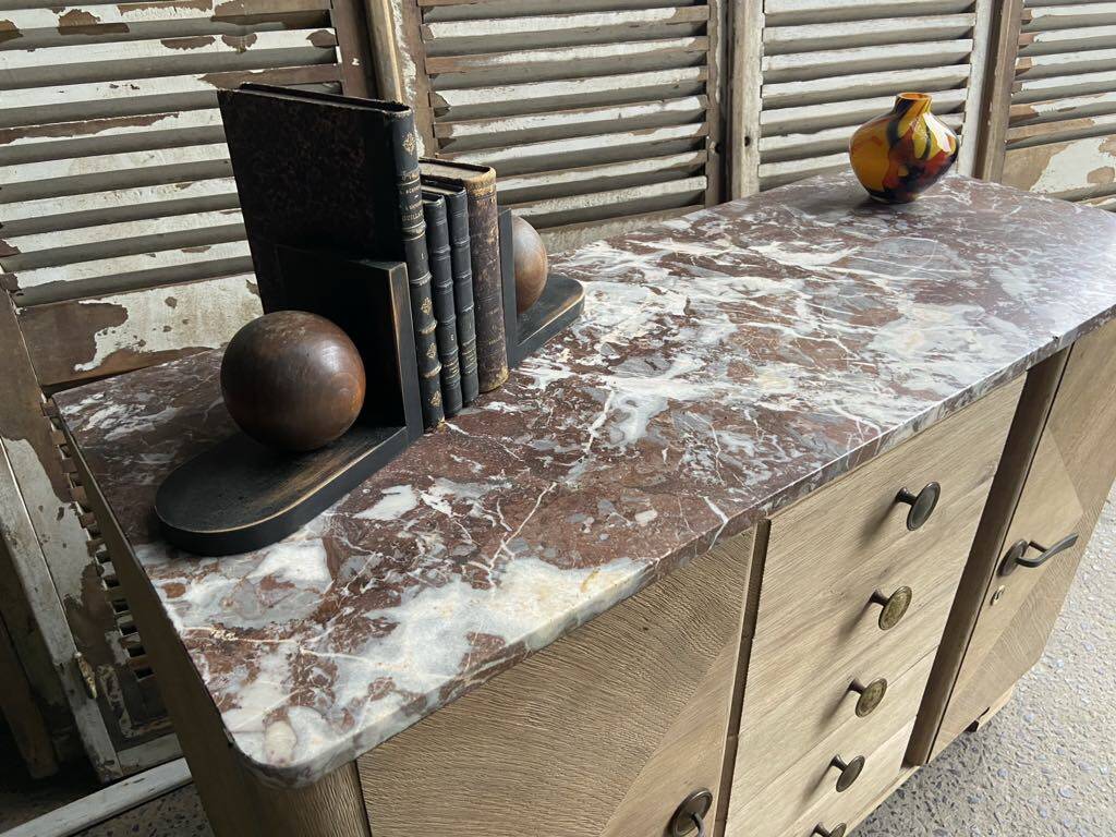 Raw wood chest of drawers with marble top