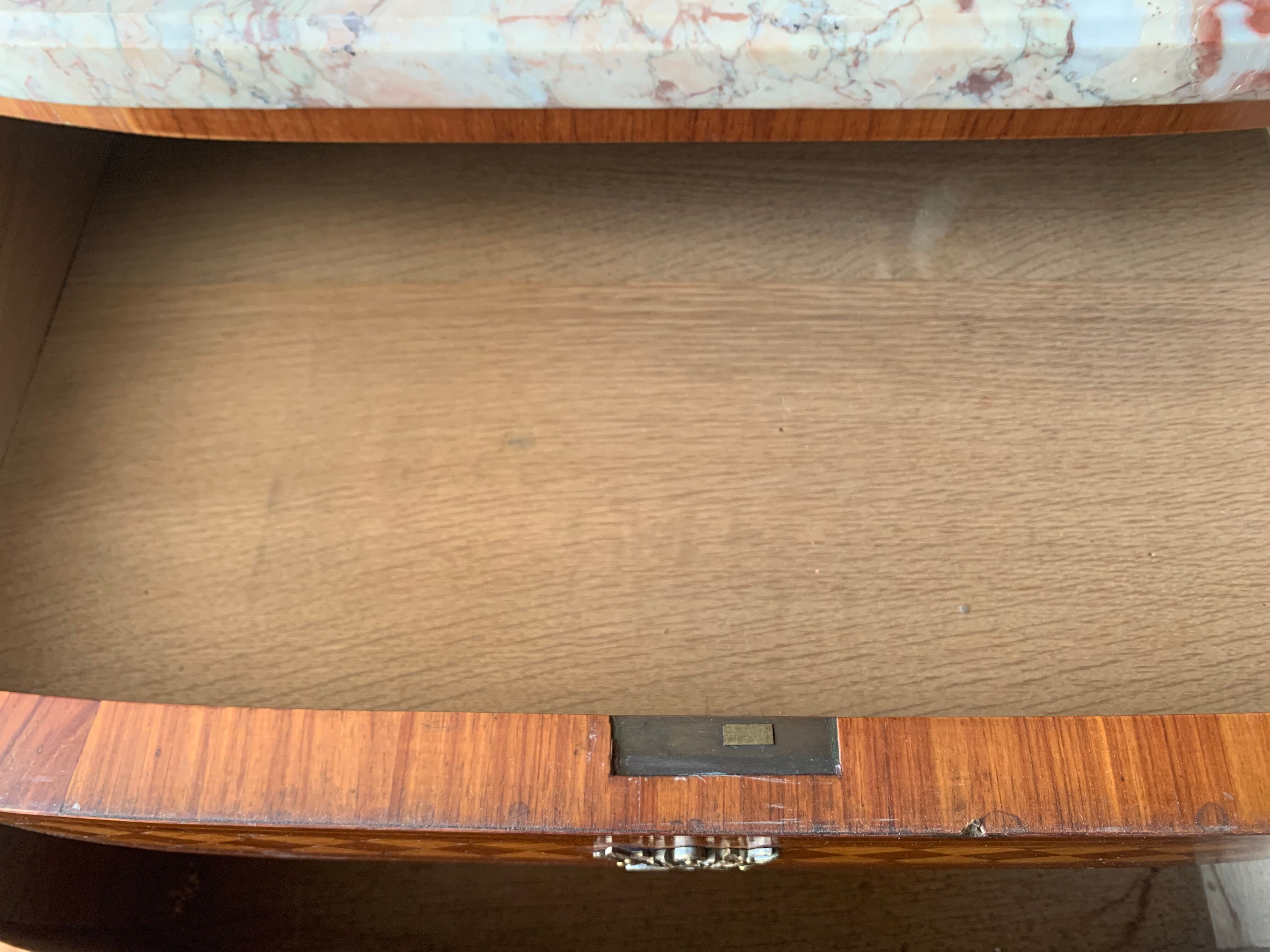 Louis XVI style half-moon chest of drawers in late nineteenth century marquetry
