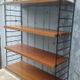 Wall shelf in Teak veneer and black metal, Nisse Strinning, 60s