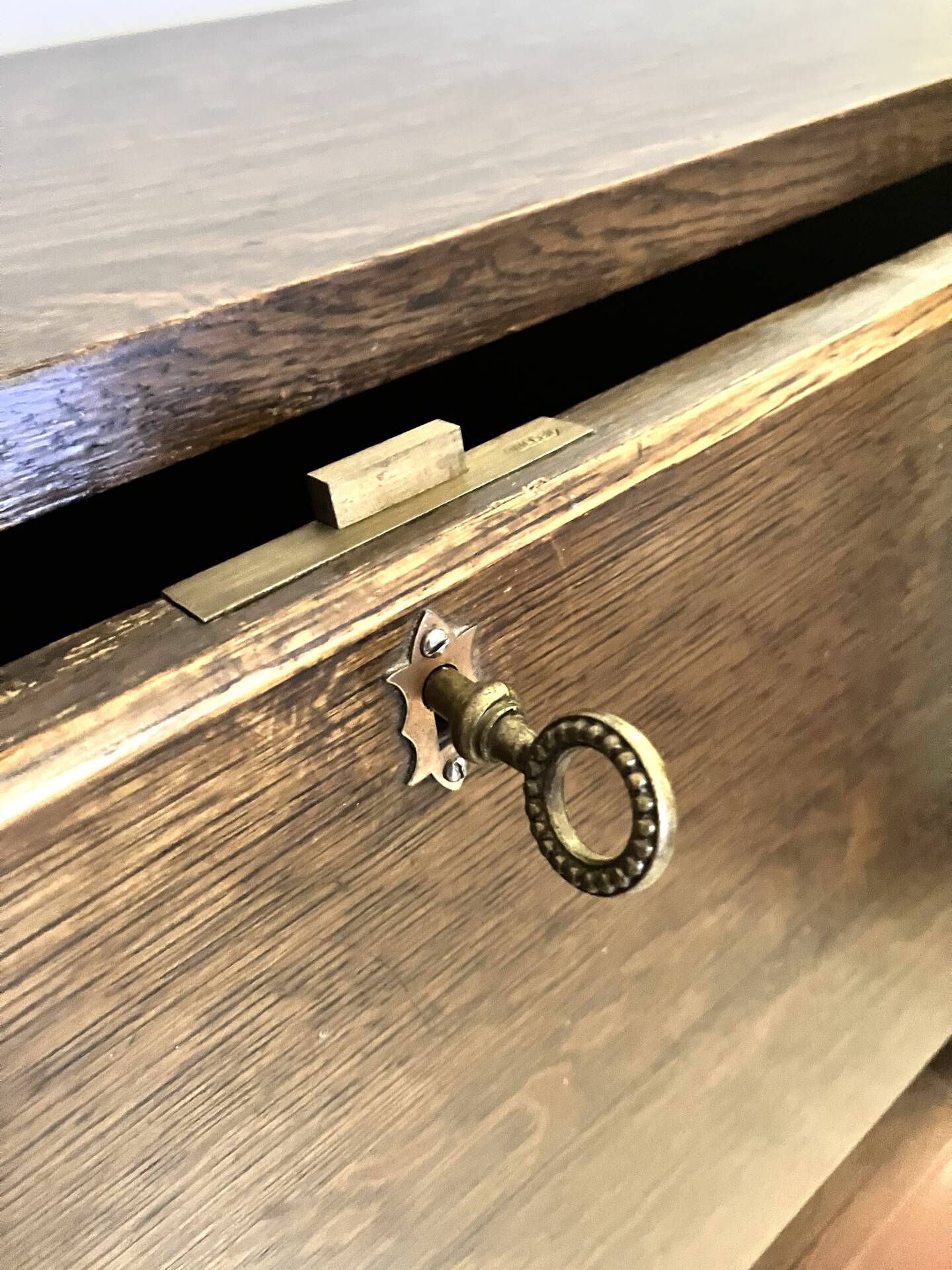 Solid oak secretary with golden feet