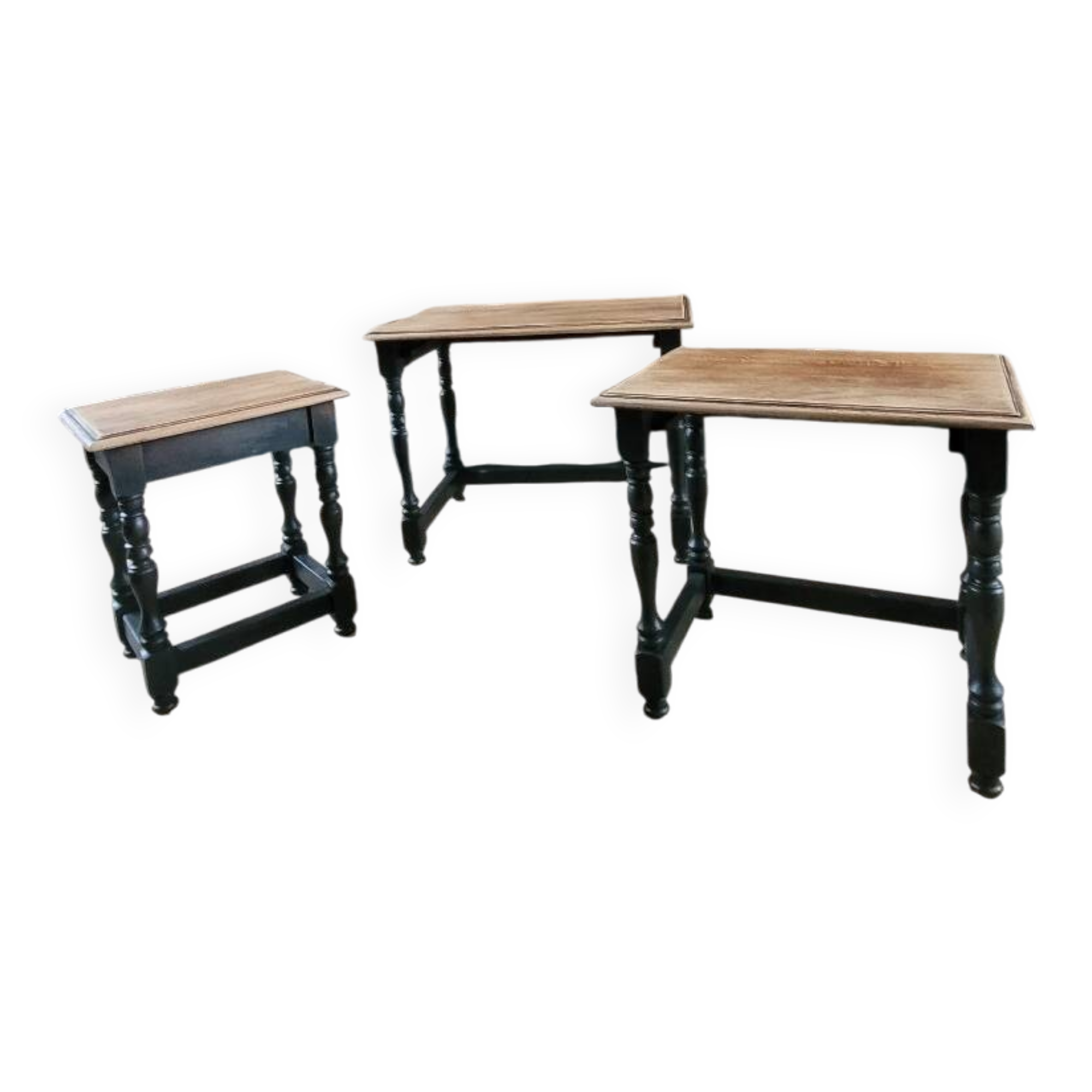 Nest tables in wood and black.