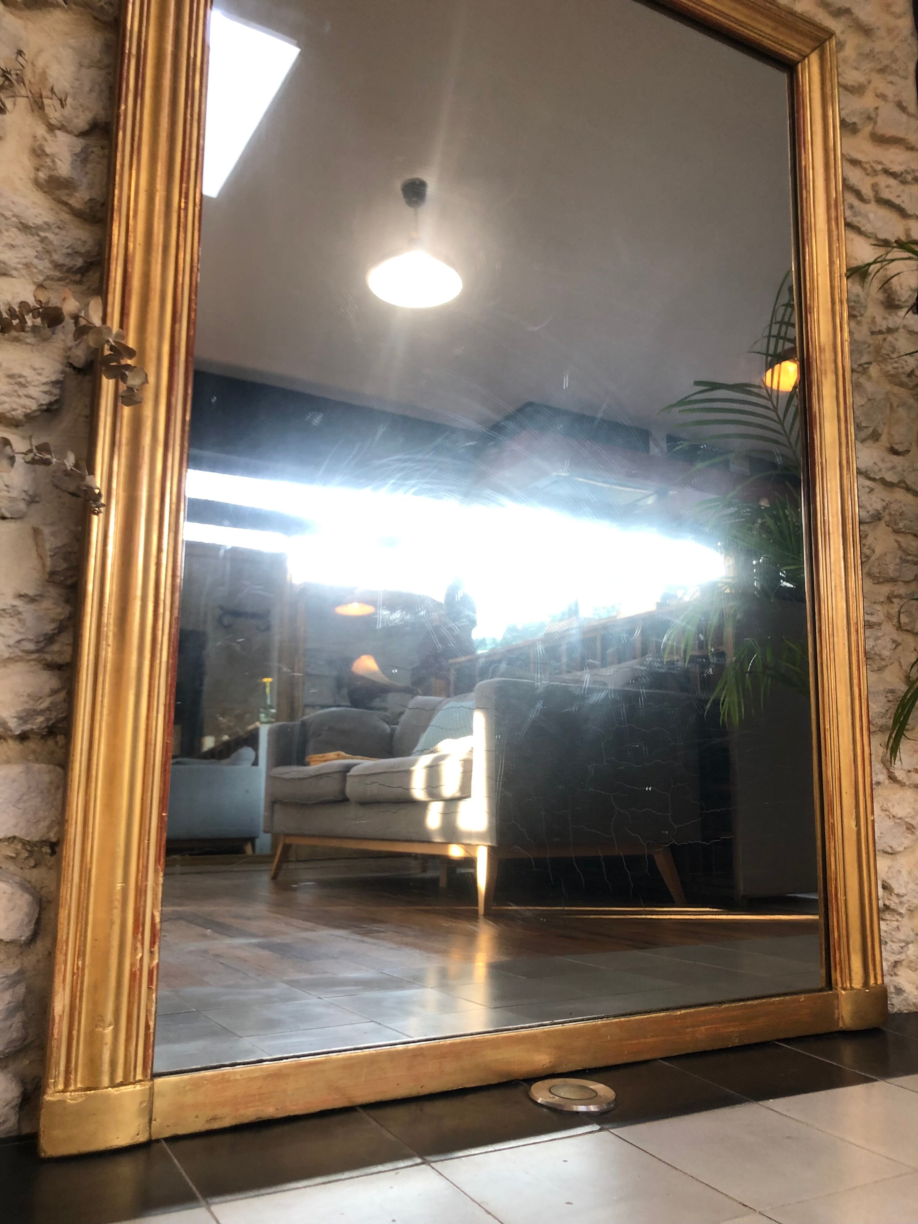 Mirror period 19th gilded with gold leaf 158.5cm / 113cm mercury ice pricked, parquet on the back.