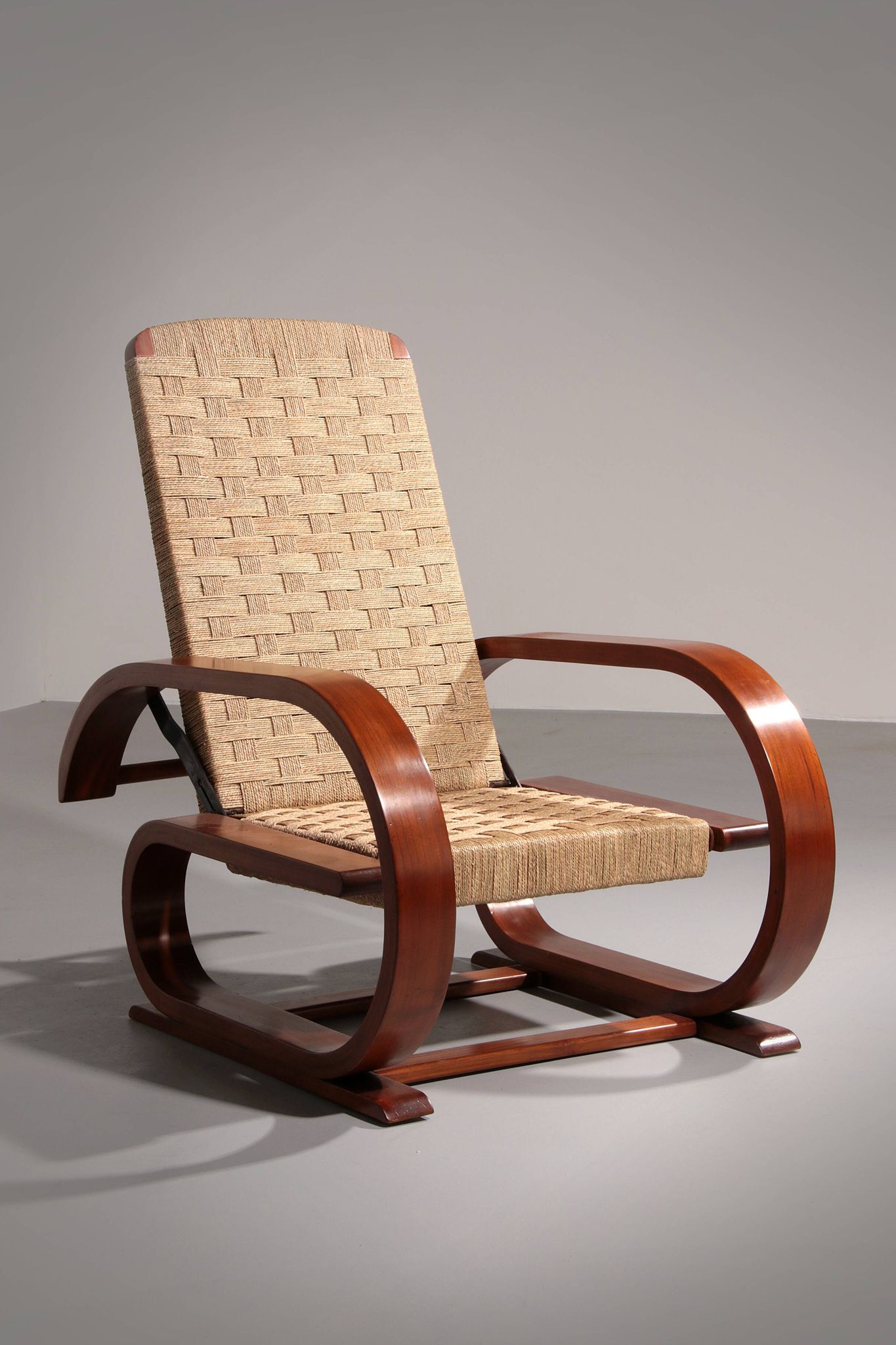 An exceptionally rare mahogany recliner crafted in Italy during the 1950s"