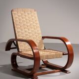 An exceptionally rare mahogany recliner crafted in Italy during the 1950s"