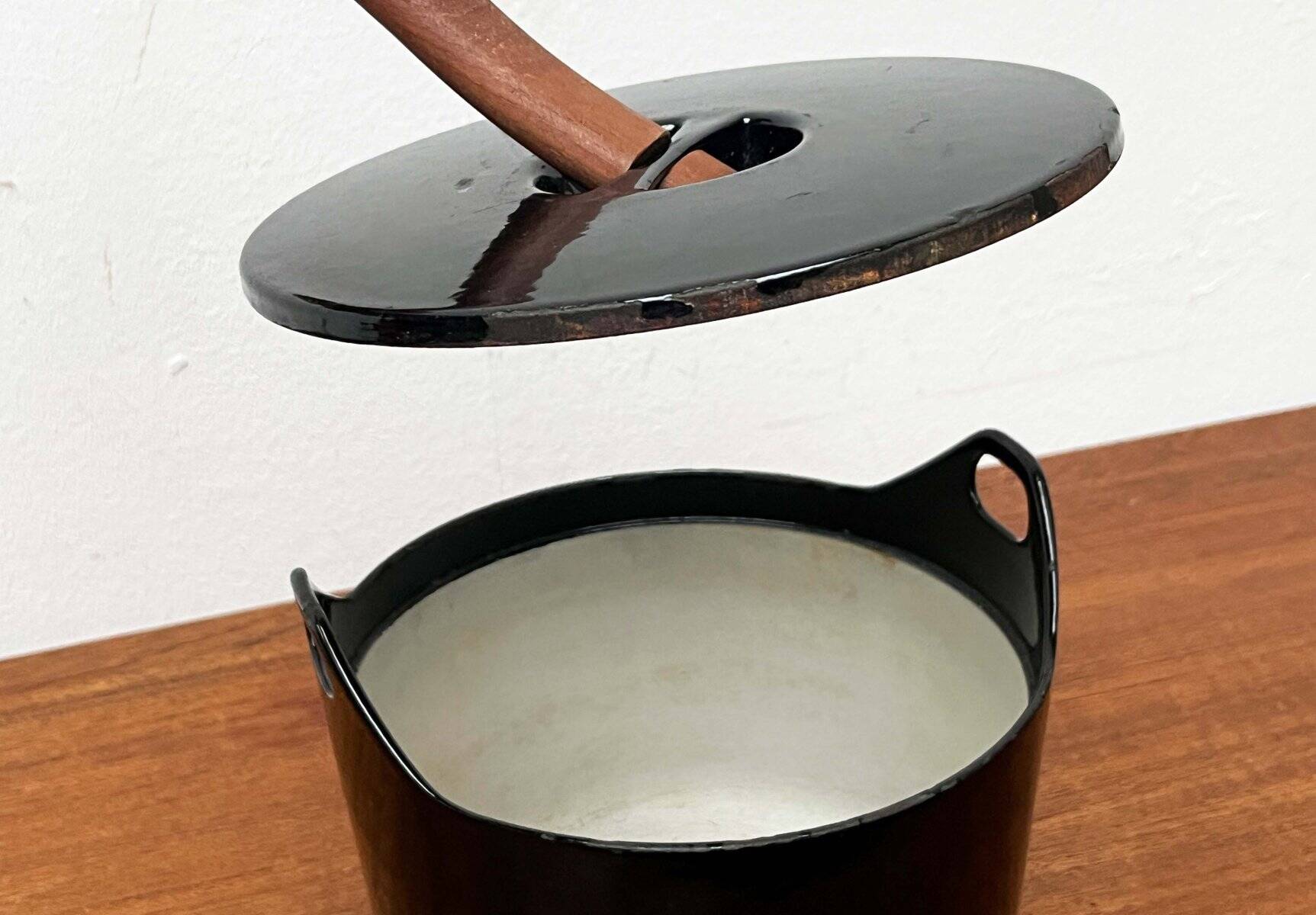 Black enamelled cast iron pot with a teak handle in mid-century style by Timo Sarpaneva for Rosenlew of Finland, 1960s.