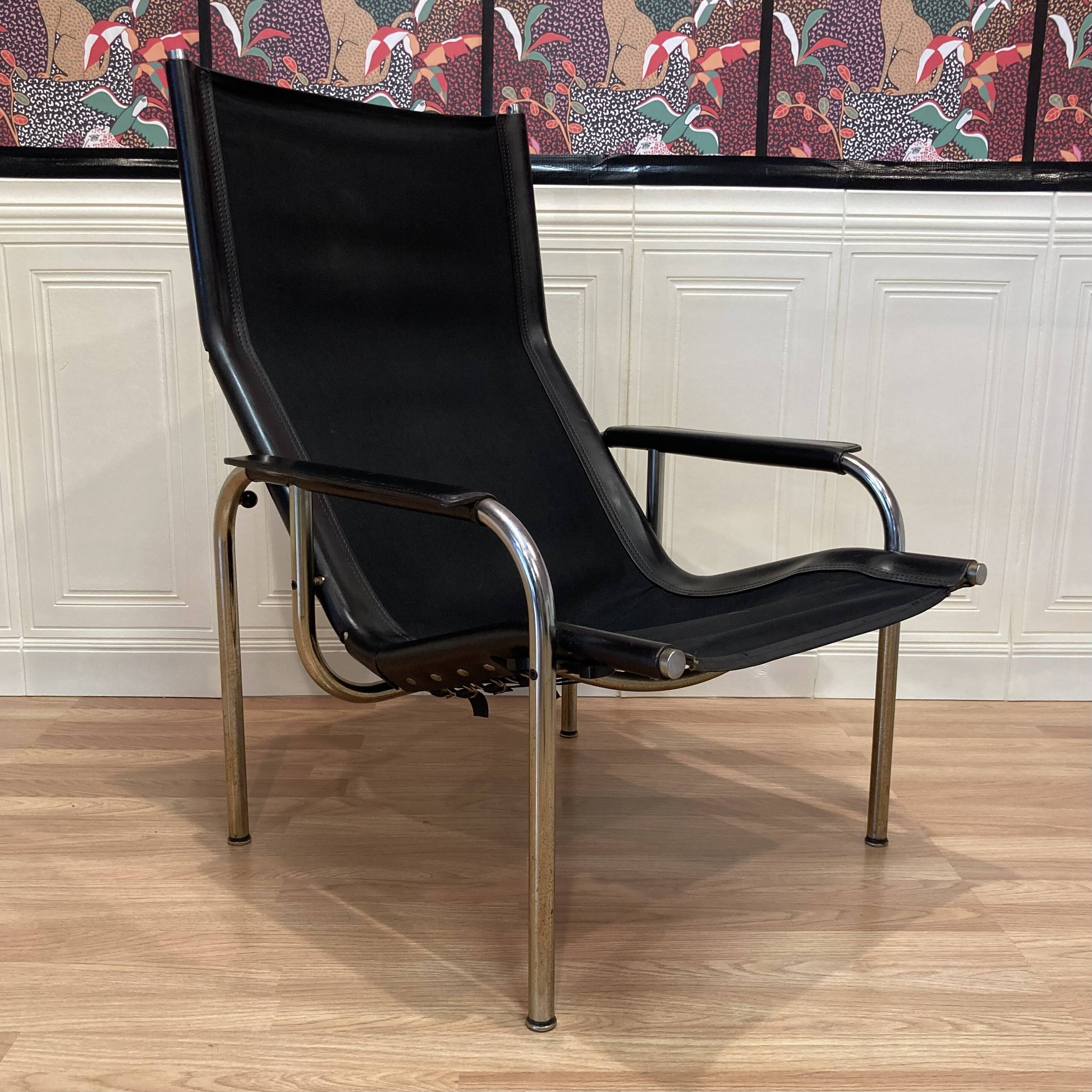 Reclining armchair in black leather and chrome design "hans eichenberger" 1960.