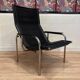 Reclining armchair in black leather and chrome design "hans eichenberger" 1960.