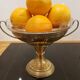 Art Deco brass cup and its engraved saucer.