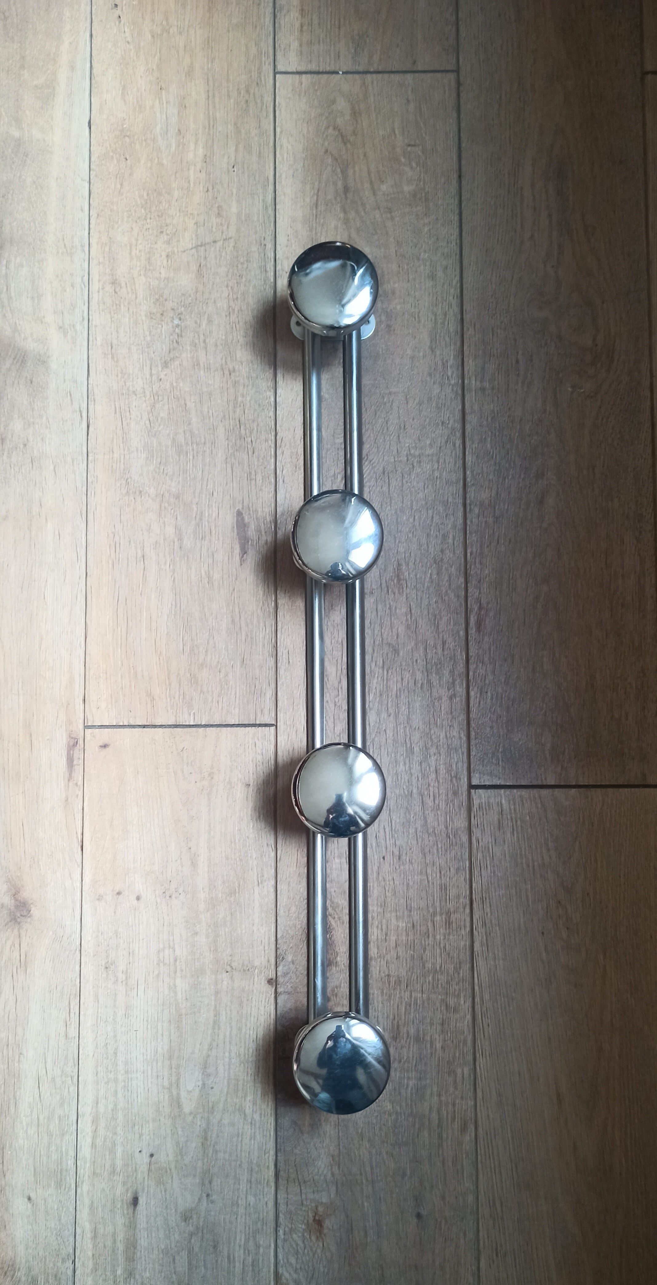 Metal wall coat rack